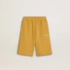 Joggingshorts för barn i ockragult med broderi