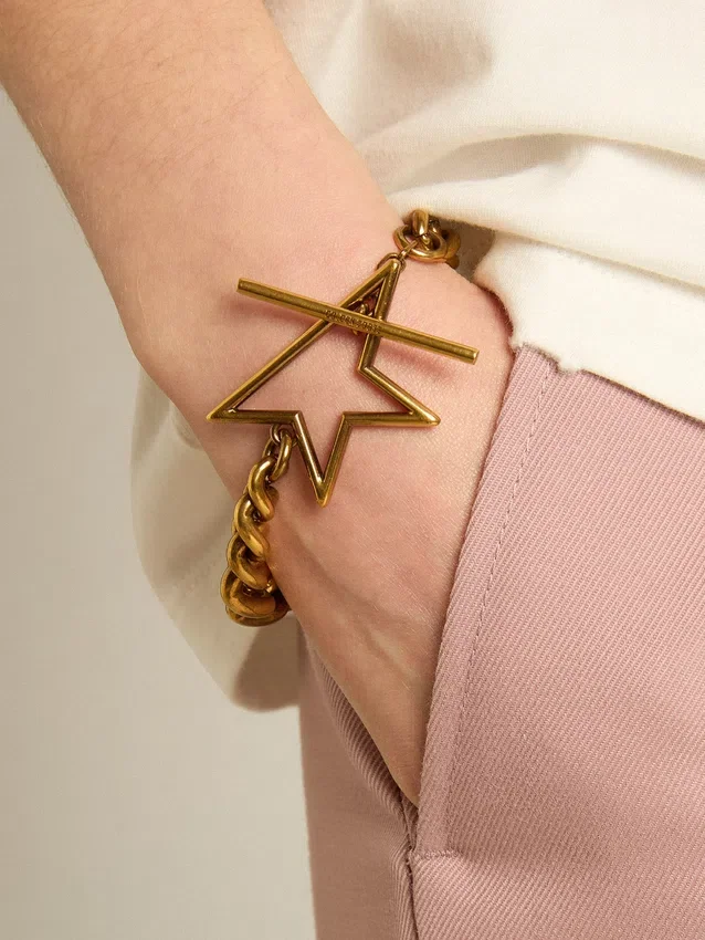 Armband i antikguldfärgad kedja med avtagande länkar och stjärnformat lås