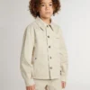 Beige barnjacka med flerfärgade stänk