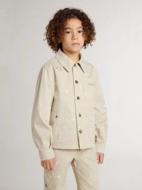 Beige barnjacka med flerfärgade stänk