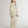 Beige barnjacka med flerfärgade stänk