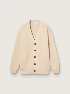 Beige damkofta med texten ”Golden” på ryggen