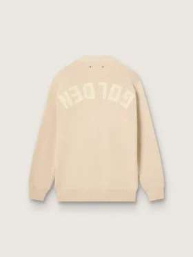 Beige damkofta med texten ”Golden” på ryggen