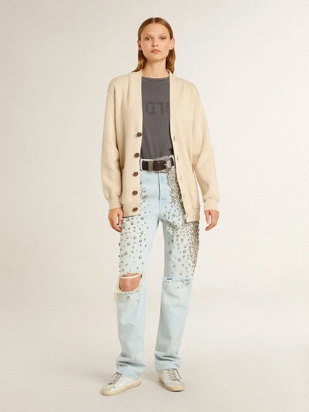 Beige damkofta med texten ”Golden” på ryggen