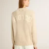 Beige damtröja med ”Golden”-text på ryggen
