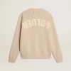Beige damtröja med ”Golden”-text på ryggen