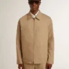 Beige herrjacka med blommig broderi och hel dragkedja