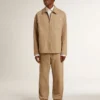 Beige herrjacka med blommig broderi och hel dragkedja