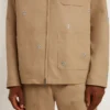 Beige herrjacka med blommig broderi och hel dragkedja