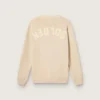 Beige herrkofta med ”Golden”-text på ryggen