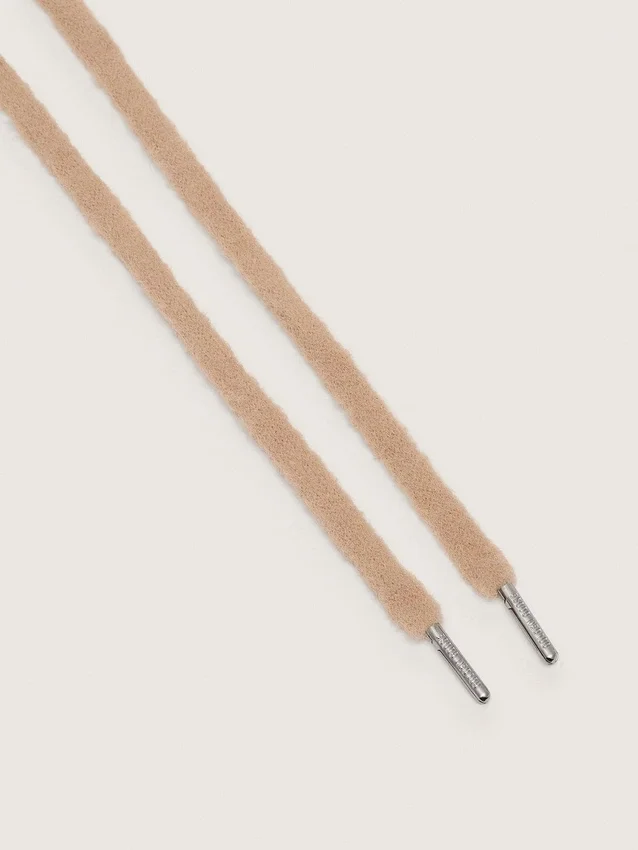 Beige puffiga skosnören