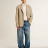 Chinobyxor i denim för herr med slitna detaljer