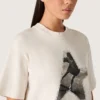 Dam-T-shirt i vit bomullsjersey med stjärntryck