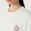 Dam-T-shirt med tryck på ryggen
