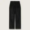 Dambyxor i svart bomullsdenim med sliten look