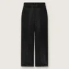 Dambyxor i svart bomullsdenim med sliten look