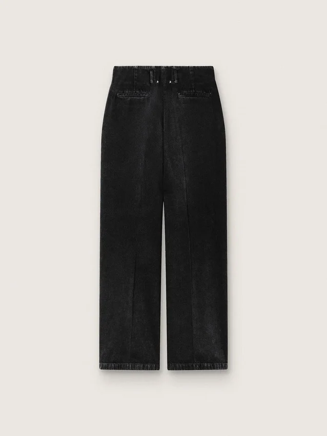 Dambyxor i svart bomullsdenim med sliten look