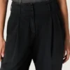 Dambyxor i svart bomullsdenim med sliten look