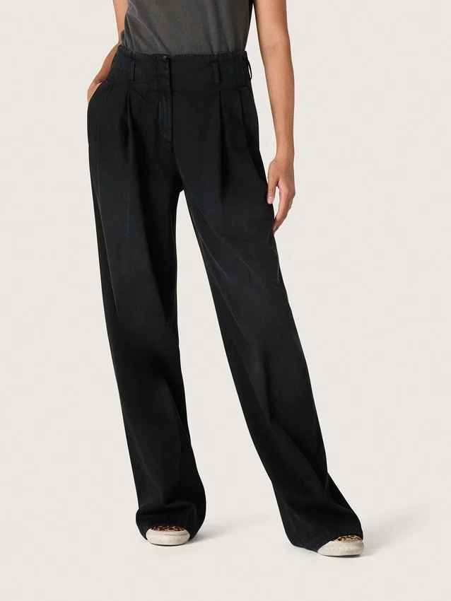 Dambyxor i svart bomullsdenim med sliten look