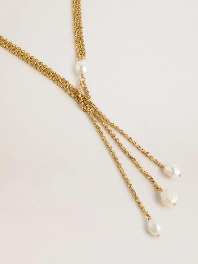 Halsband med antikguldfärgade kedjor med pärlor
