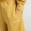 Joggingshorts för barn i ockragult med broderi