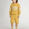 Joggingshorts för barn i ockragult med broderi