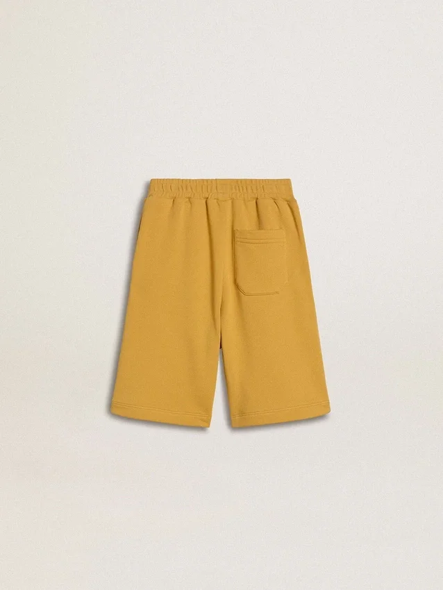Joggingshorts för barn i ockragult med broderi