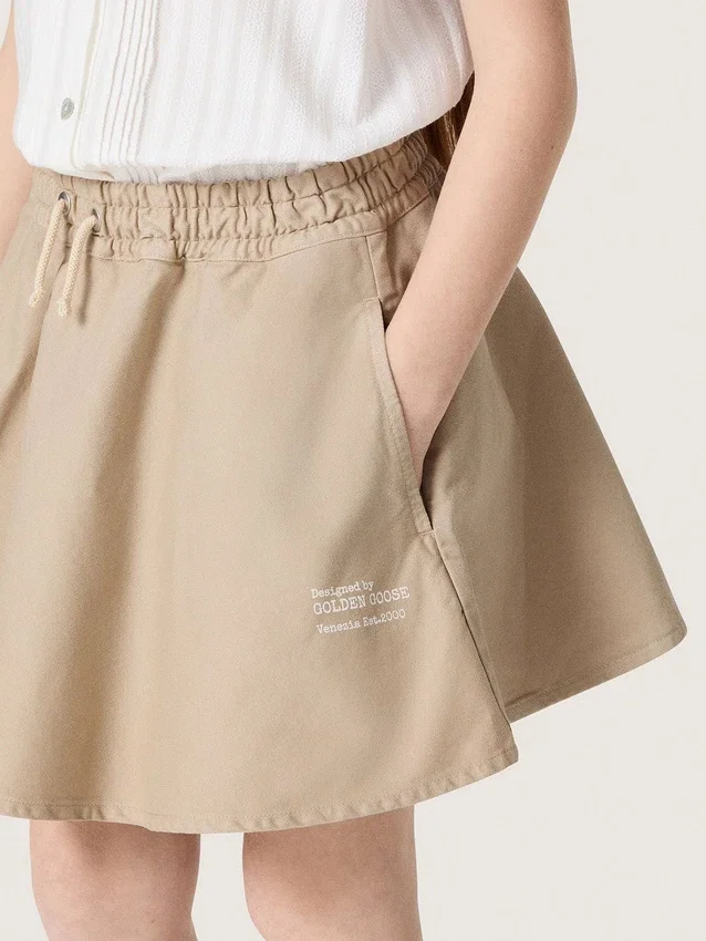 Journey-minikjol för flickor i beige bomullsgabardin med tryck