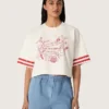 Kort T-shirt för damer i vit bomull med tryck och broderi