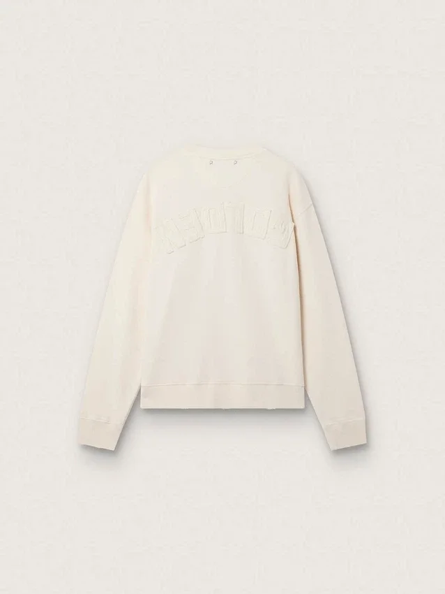 Krämfärgad LTD-tröja med broderad patch
