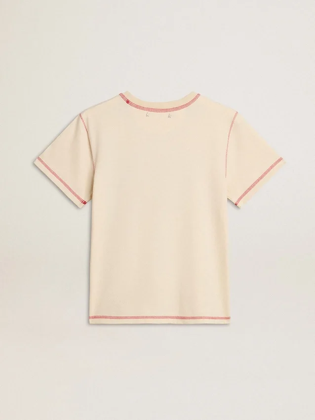 Krämfärgad T-shirt för dam med blekta röda detaljer