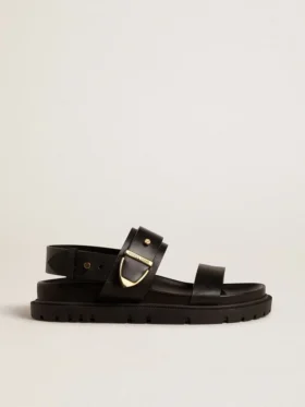 Lucy-sandal för dam i glansigt svart läder med guldspänne i metall