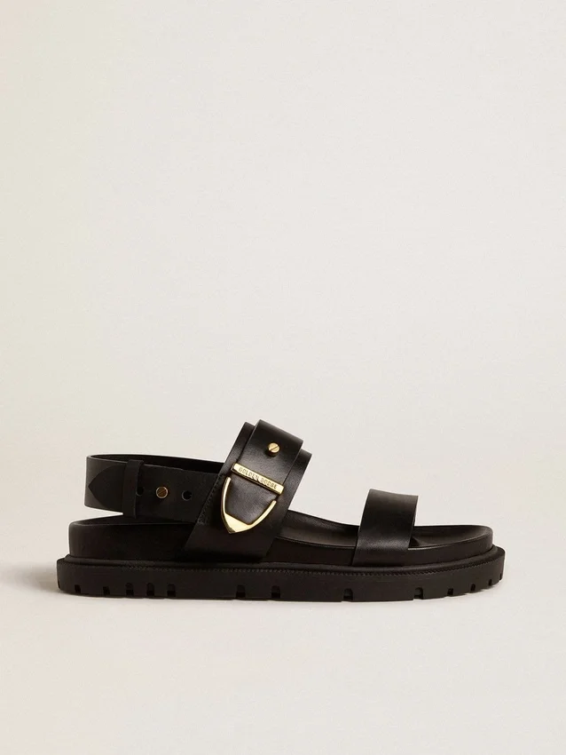 Lucy-sandal för dam i glansigt svart läder med guldspänne i metall
