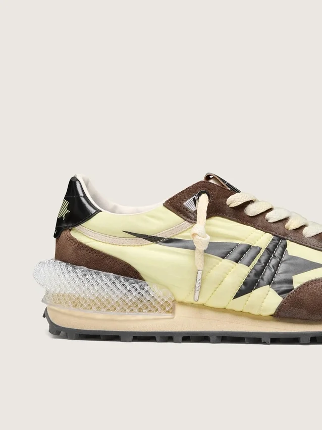 Marathon för damer i limegrönt nylon med svart stjärna och insatser i brunt mocka