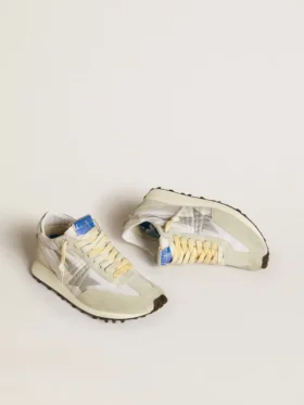 Marathon för damer med vit nylonöverdel och silverfärgad stjärna