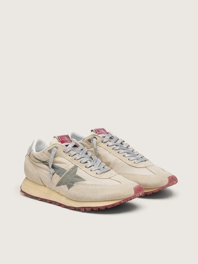 Marathon för herr med beige nylonöverdel och grå stjärna