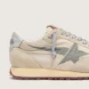 Marathon för herr med beige nylonöverdel och grå stjärna