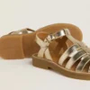 Maxime Young-sandaler i guldfärgat läder