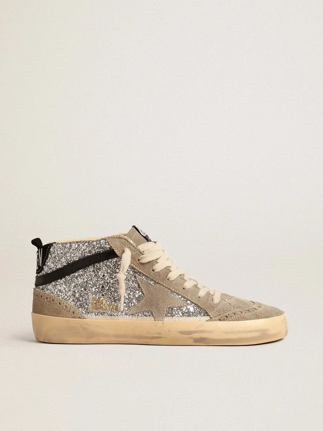 Mid Star i silverglitter med stjärna i mocka och svarta detaljer