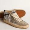 Mid Star i silverglitter med stjärna i mocka och svarta detaljer
