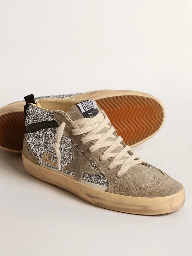 Mid Star i silverglitter med stjärna i mocka och svarta detaljer