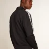Mörkblå sweatshirt med vit rand och kontrasterande blå stjärnor