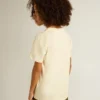 Pojk-T-shirt i slitet vitt med flerfärgad text