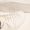 Purestar-sneakers för damer med guldfärgad hälflik