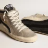 Slide i beige mesh och nylon med blå läderstjärna och blixtsymbol
