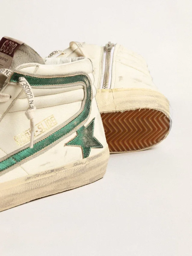 Slide i beige nappa med grön stjärna och blixt i laminerat läder