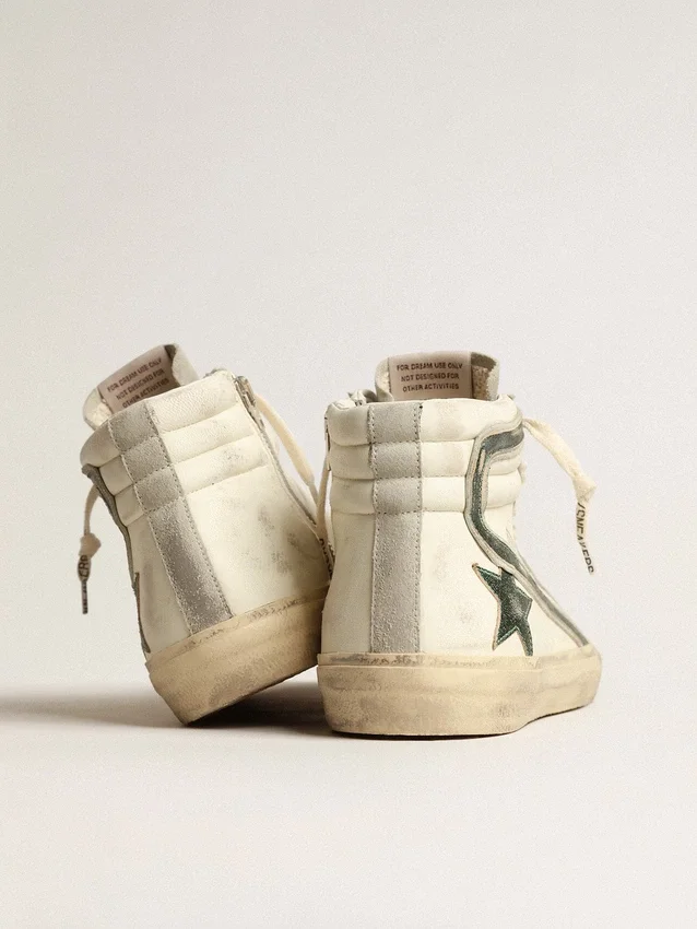 Slide i beige nappa med grön stjärna och blixt i laminerat läder