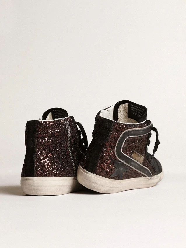 Slide i brunt glitter med svart läderstjärna och glitter