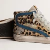Slide i ponnyskinn med leopardmönster och silverfärgad läderstjärna