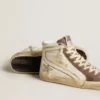 Slide-sneakers i nappa med glitterstjärna och detaljer i lackläder